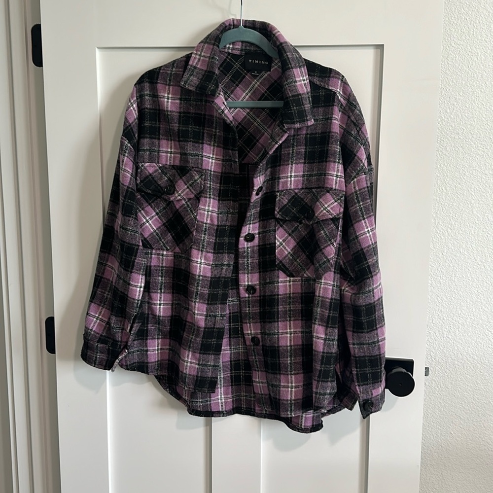 Timing size Medium purple black grey white plaid flannel. Button up High low EUC